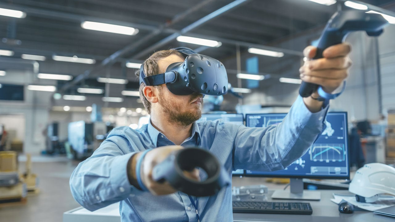 Industrial Engineer Wearing VR Headset and Controllers